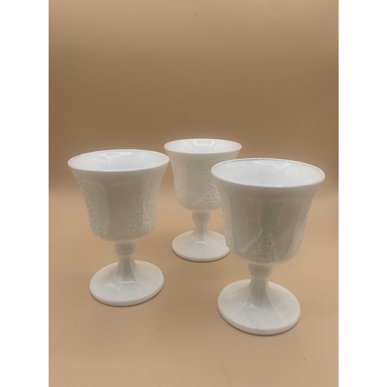 Vintage Sets of Paneled Grape and Leaves Pattern Milk Glass Goblets and Glasses